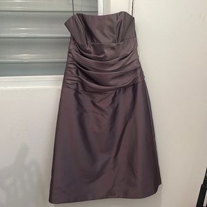 Only used once. Strapless dress with bow in the back.